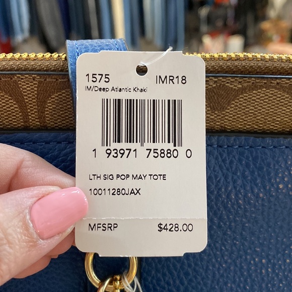 Blue leather Coach tote with brown signature strip on top. - Picture 5 of 7